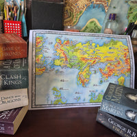 Load image into Gallery viewer, Map of Essos with Game of Thrones books around it
